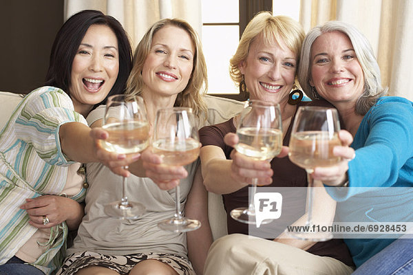 Friends Drinking Wine in Living Room