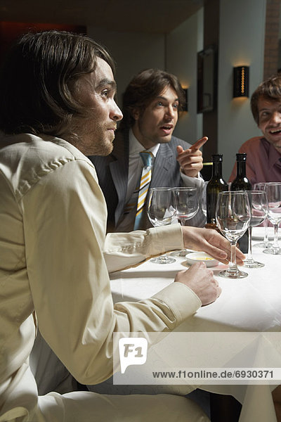 Men at Business Meeting in Restaurant