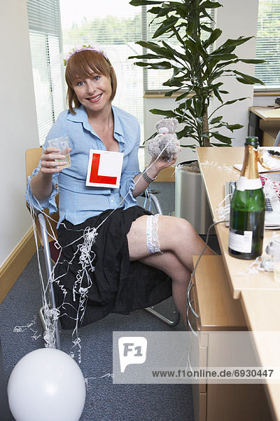 Businesswoman in Office with Decorations