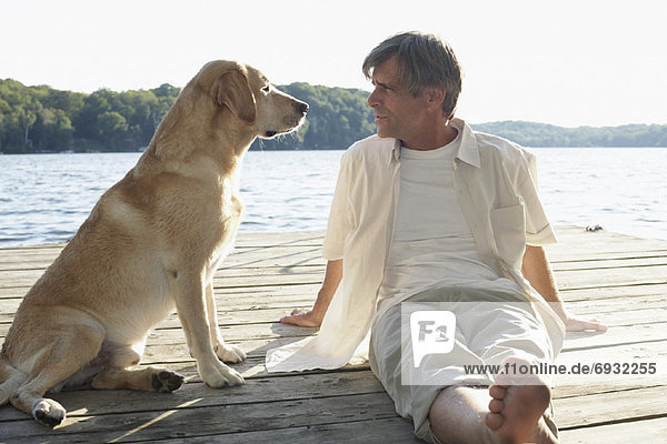 Man Outdoors with Dog  Three Mile Lake  Muskoka  Ontario  Canada