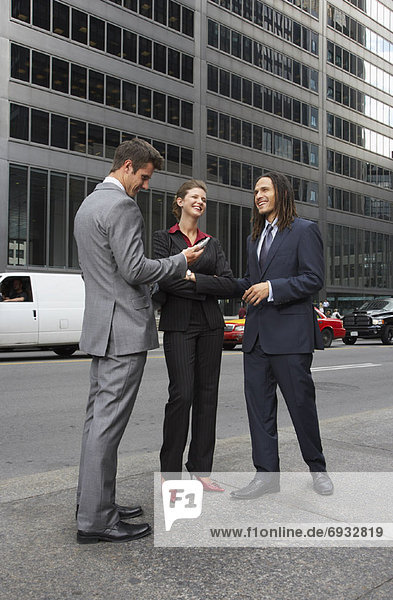 Business People Standing on Sidewalk