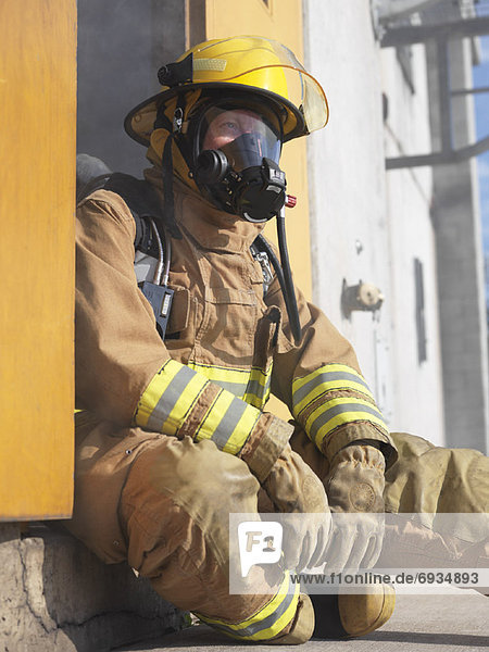 Firefighter in Doorway of Smoke-filled Building