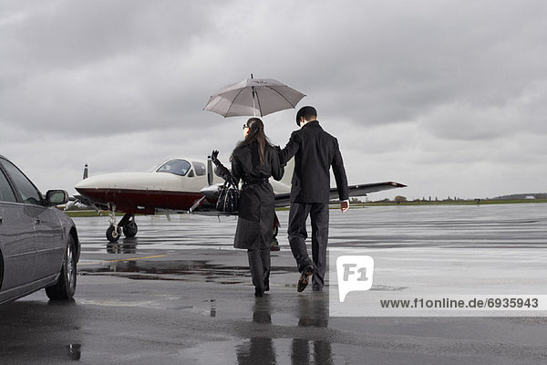 Man and Woman on Airport Tarmac