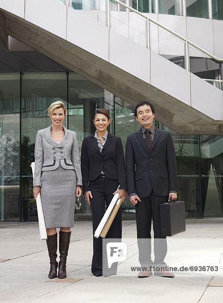 Portrait of Business People in Front of Building