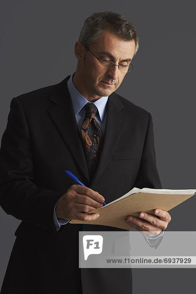 Businessman with File Folder