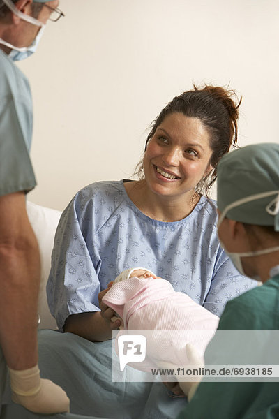 Woman Holding Newborn