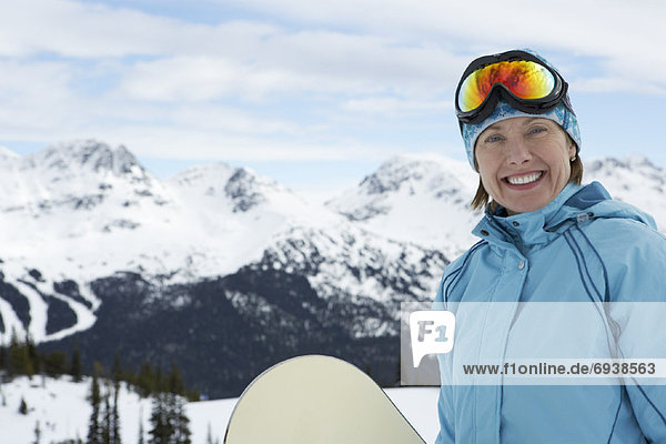 Portrait of Woman with Snowboard  Whistler  BC  Canada