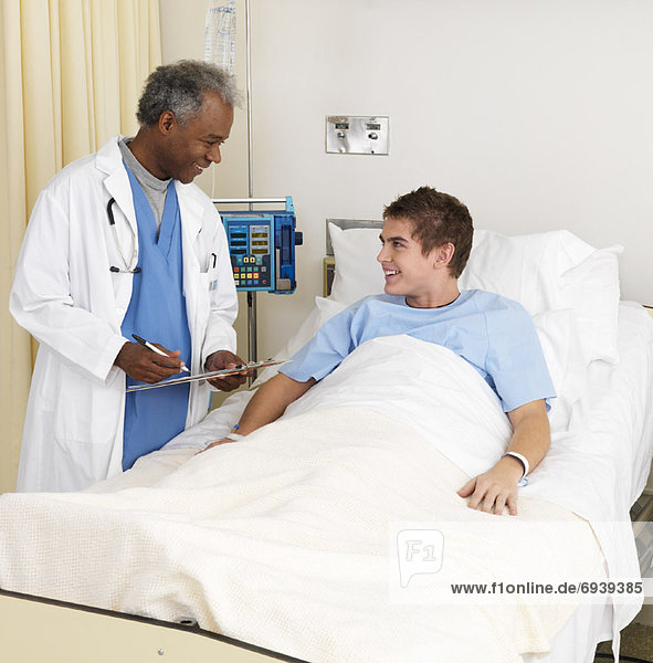 Boy and Doctor in Hospital Room