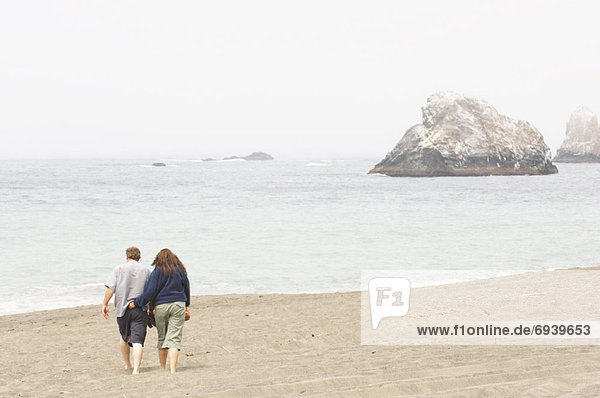 Couple Walking on Beach  Sonoma Coast  California  USA