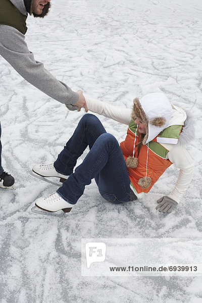 Man Helping Woman Up from Ice