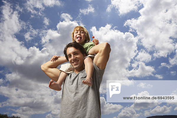 Boy Riding on Fathers Shoulders