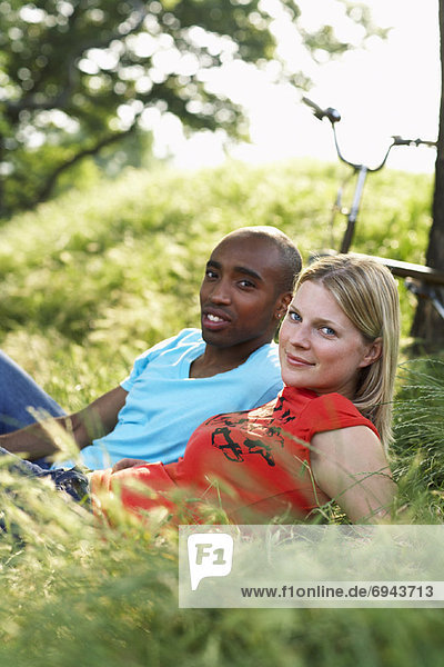 Couple Lying in Grass