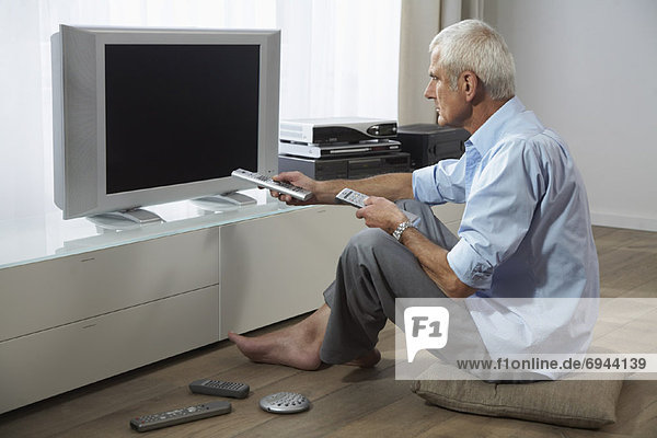 Man Trying to Watch Television