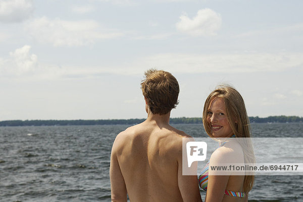 Couple Standing by Lake