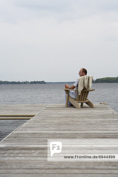 Man Relaxing on Dock