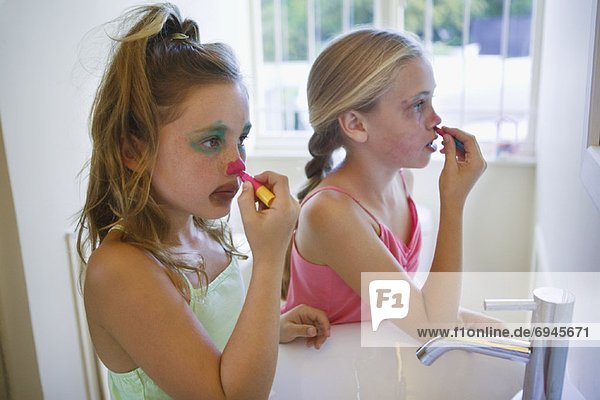 Girls Applying Clown Make-up