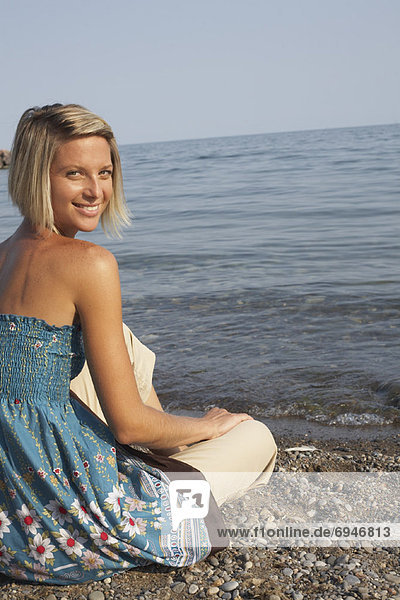 Woman Sitting on Beach