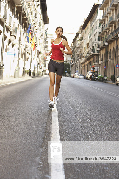 Woman Jogging on Street