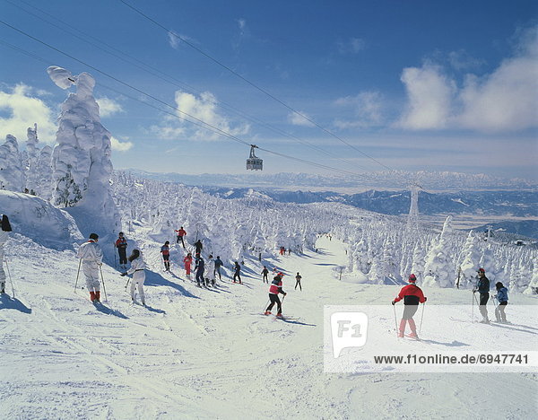 People skiing in mountain  Yamagata city  Yamagata prefecture  Japan