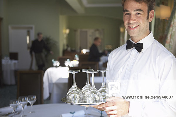 Waiter Carrying Tray of Wine Glasses