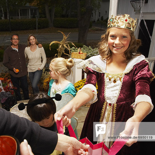 Portrait of Girl and other Children Trick or Treating at Halloween