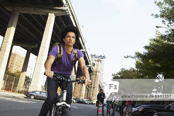 Teenaged Boy on Bicycle