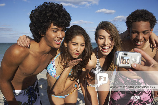 Friends Posing for Picture on Beach