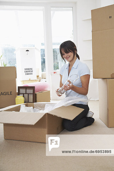 Woman Packing Boxes