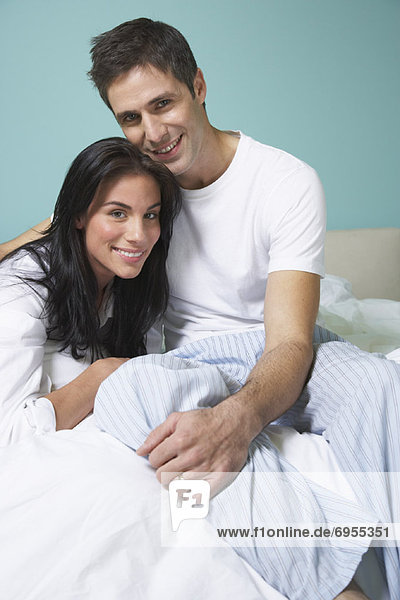Portrait of Couple on Bed