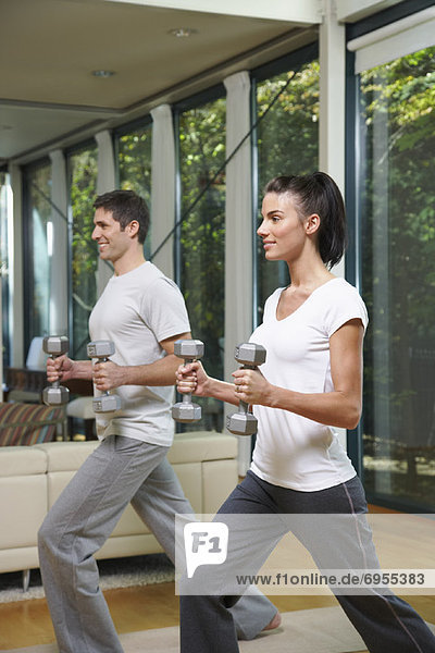 Couple Exercising in Home