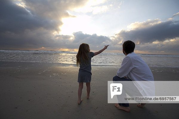 Father and Daughter on the Beach