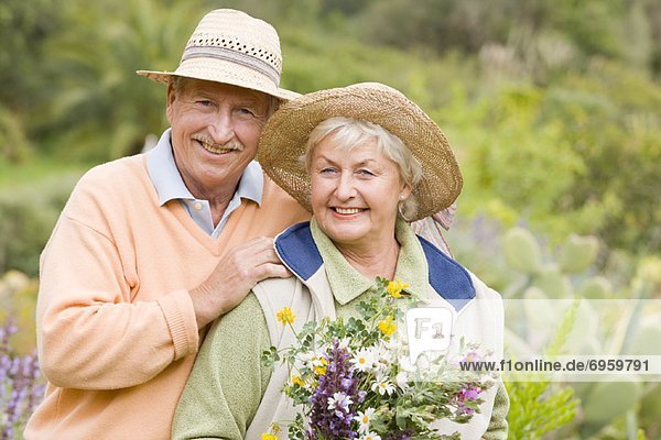 Portrait of Couple  Woman Holding Flowers