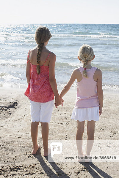 Rear View of Girls Holding Hands on the Beach  Elmvale  Ontario  Canada