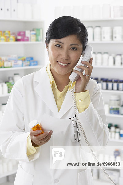 Portrait of Pharmacist Talking on the Phone