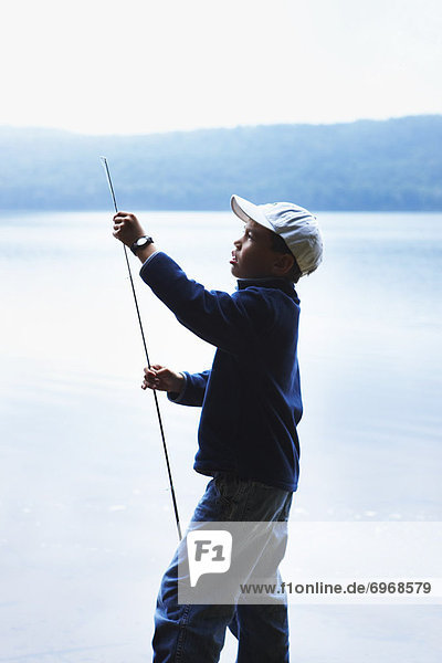 Boy Adjusting Fishing Rod  Algonquin Park  Ontario  Canada