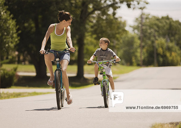 Woman and Boy Riding Bicycles