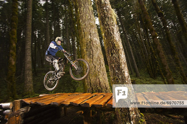 Mountain Biker Performing a Stunt  Blackrock Mountain Bike Park  Near Salem  Oregon  USA