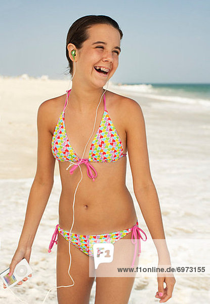 Girl on Beach With Mp3 Player