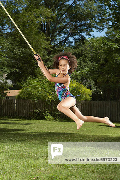 Girl Swinging on Rope
