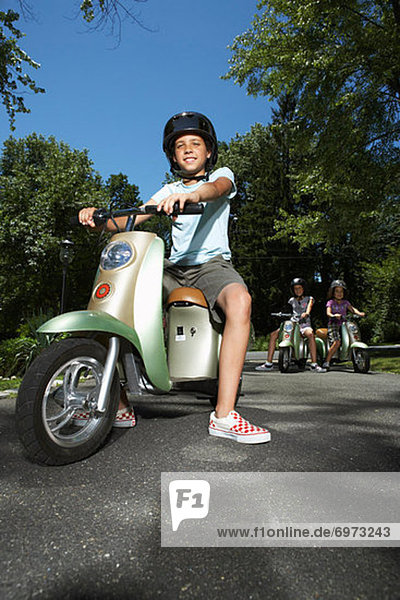 Girl Riding Scooter