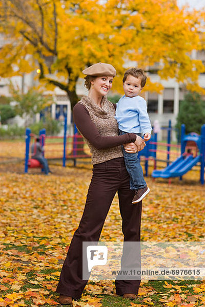 Portrait of Mother and Son in the Park in Autumn  Portland  Oregon  USA