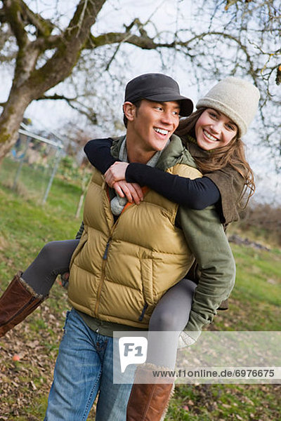 Teenage Boy Giving Girlfriend a Piggyback Ride  Hillsboro  Oregon  USA