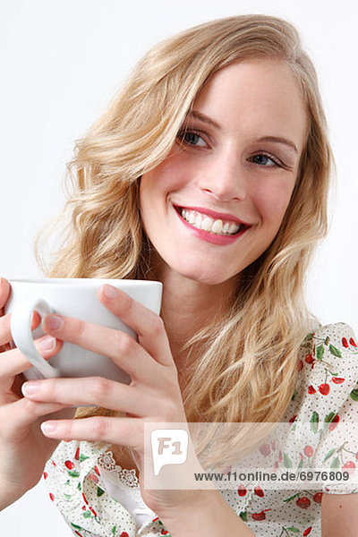 Woman Enjoying a Cup of Coffee