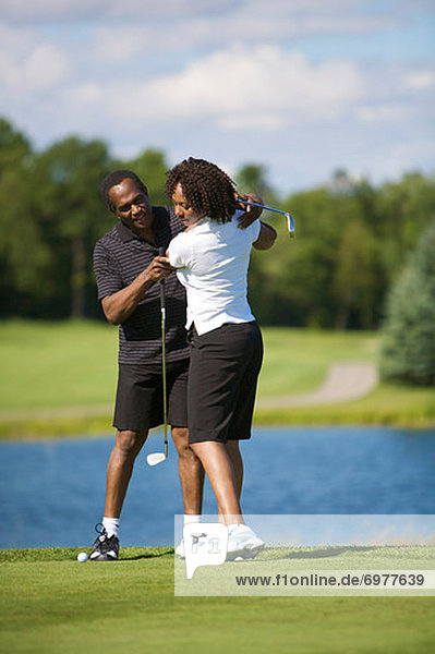 Couple Golfing