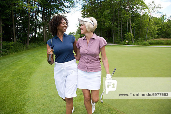 Women Walking on Golf Course