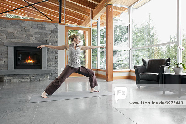 Woman Doing Yoga in Living Room of Large Alpine Home