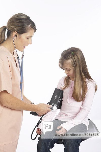 Nurse Testing Childs Blood Pressure