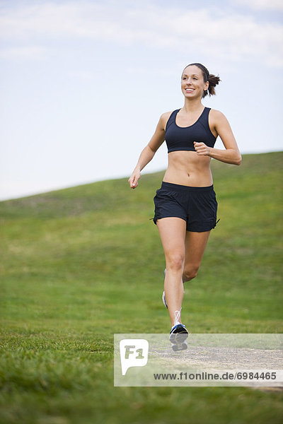 Woman Running in Park  Seattle  Washington  USA