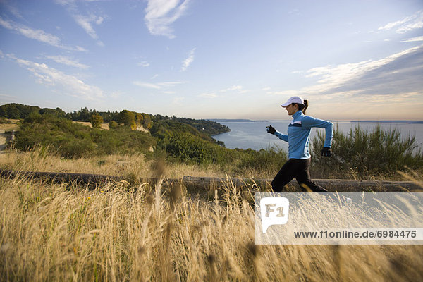 Woman Running near Puget Sound  Seattle  Washington  USA