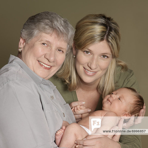 Portrait of Mother and Grandmother With Newborn Baby